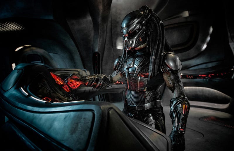 Still from the 2018 film The Predator. A Predator alien operates a computer terminal.